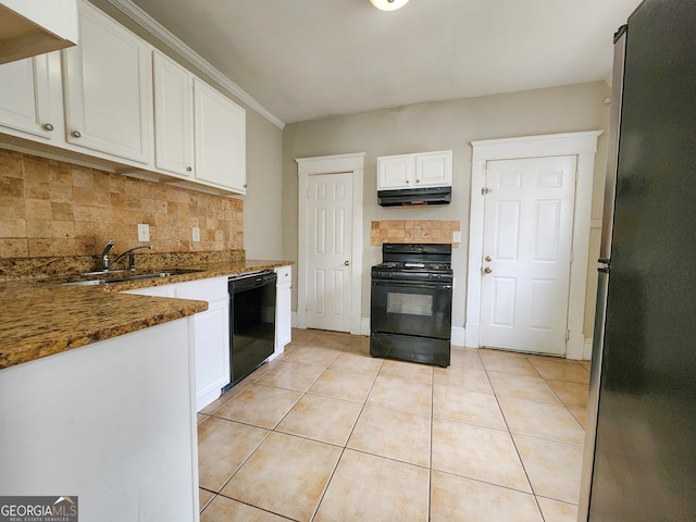 kitchen featuring light tile patterned floors, under cabinet range hood, a sink, white cabinets, and black appliances