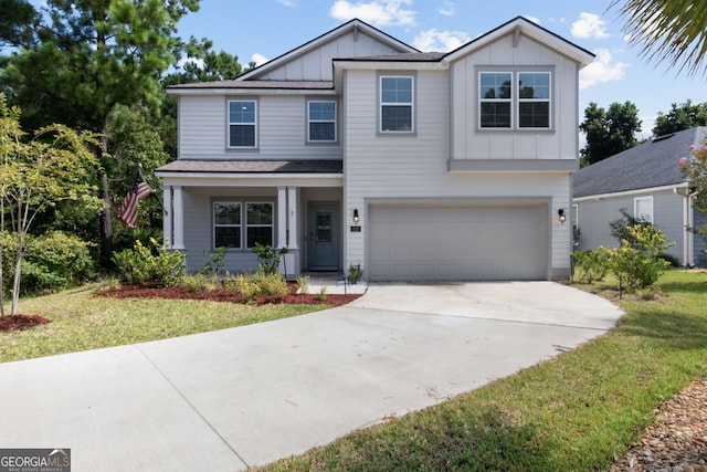 view of front facade with a garage and a front lawn