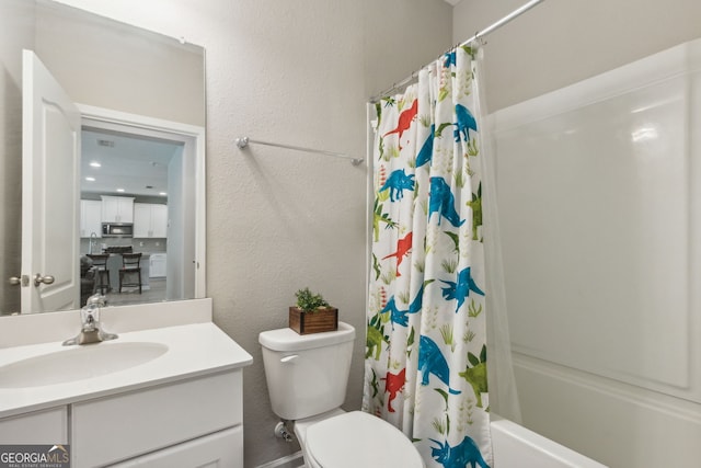 full bathroom featuring shower / tub combo with curtain, toilet, and vanity