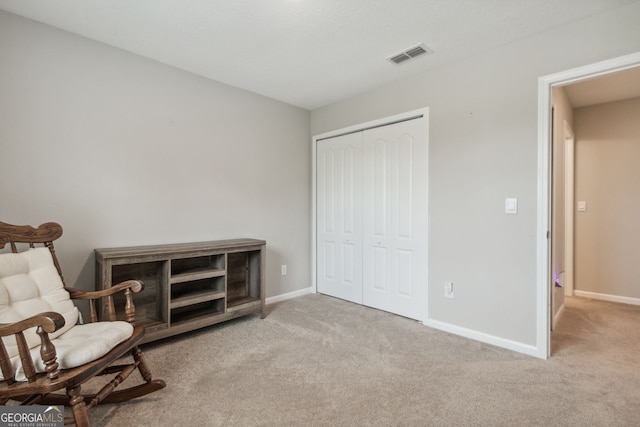 living area with carpet