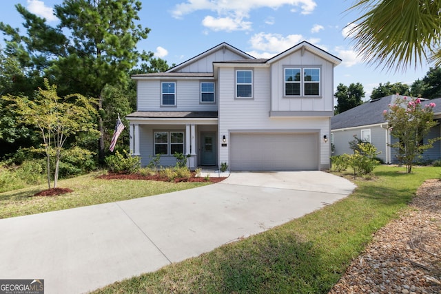 view of front of property featuring a garage and a front lawn