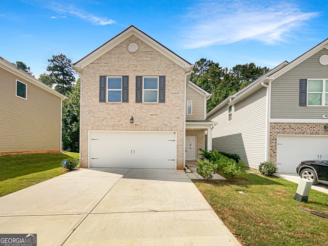 view of front of home with a front yard and a garage