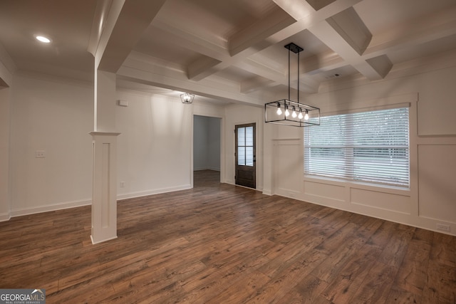 unfurnished dining area with beamed ceiling, dark hardwood / wood-style flooring, and coffered ceiling