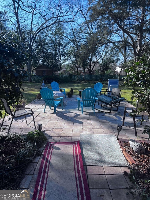 view of patio / terrace featuring a fire pit