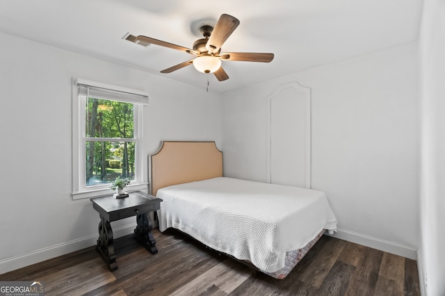 bedroom featuring ceiling fan and dark wood-type flooring