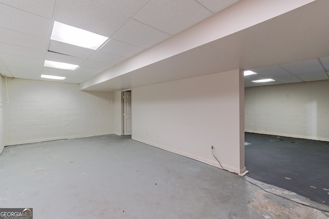 basement featuring a drop ceiling