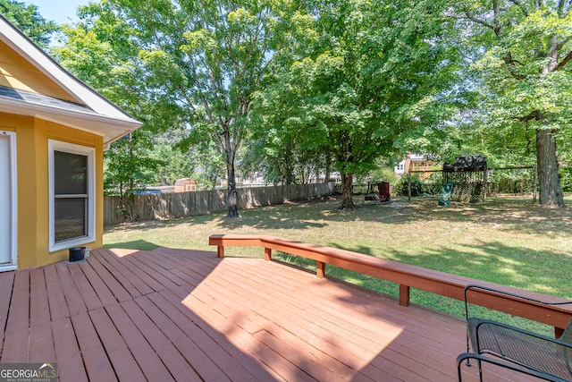 wooden deck with a yard