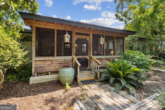 view of front of house featuring a sunroom