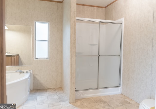 bathroom featuring toilet, tile patterned flooring, crown molding, and plus walk in shower