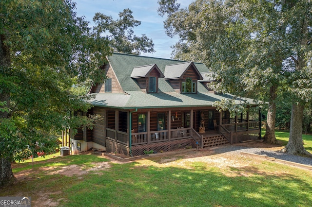 log-style house with a front yard and a porch