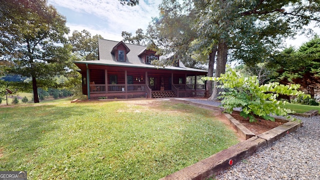 exterior space featuring covered porch and a yard