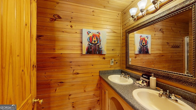 bathroom with wooden walls, wooden ceiling, and double sink vanity