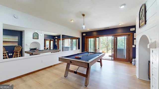 playroom with billiards and light hardwood / wood-style floors