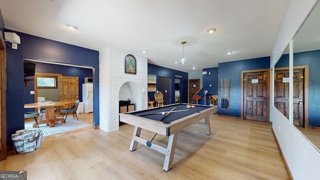 recreation room with billiards and light hardwood / wood-style floors