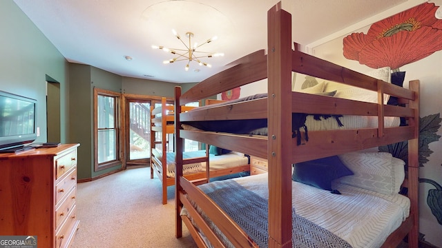 bedroom with light carpet and a chandelier