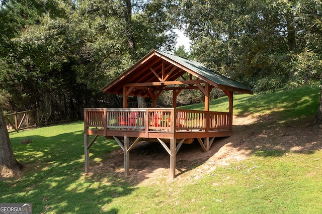 exterior space with a yard, a gazebo, and a wooden deck