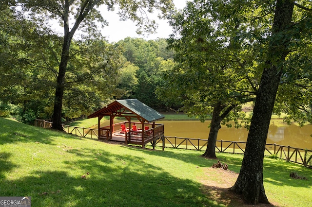 view of property's community featuring a gazebo and a lawn