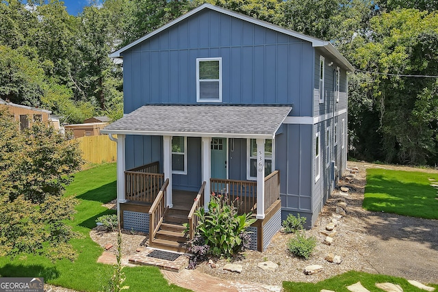 view of front of house with a front lawn and covered porch