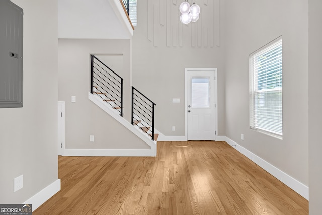 foyer featuring light wood-type flooring and electric panel