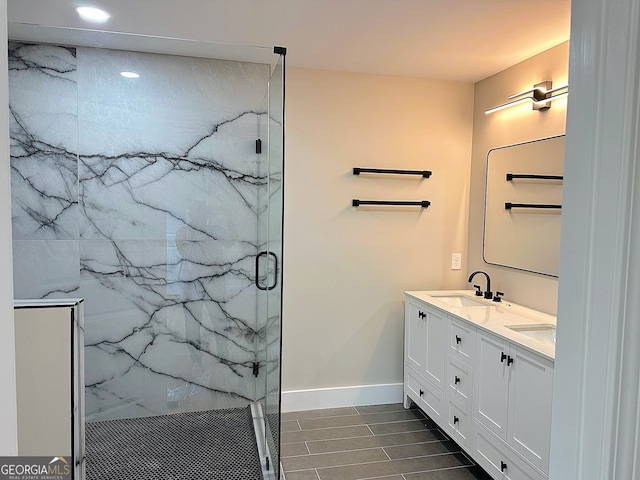 bathroom with a shower with door and vanity