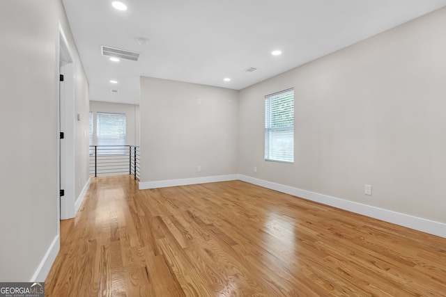 unfurnished room with light hardwood / wood-style flooring