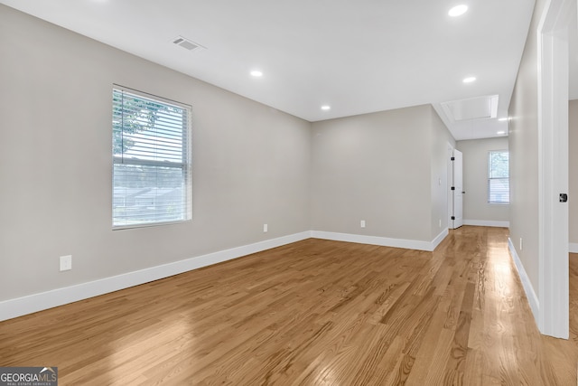 spare room with light hardwood / wood-style flooring