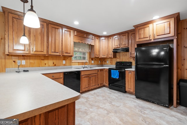 kitchen featuring decorative light fixtures, sink, black appliances, kitchen peninsula, and light tile patterned flooring