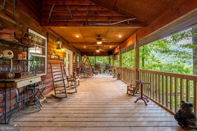 wooden deck featuring ceiling fan