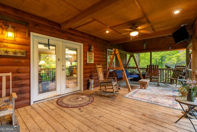 wooden deck featuring ceiling fan and french doors