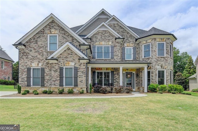 craftsman-style home featuring a front yard