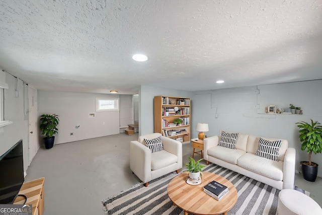 living room with a textured ceiling