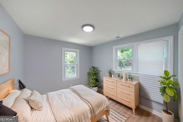 bedroom featuring light wood-type flooring