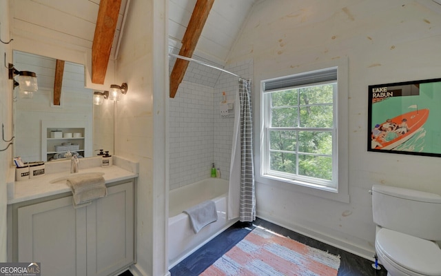 full bathroom featuring toilet, vanity, a healthy amount of sunlight, and lofted ceiling with beams