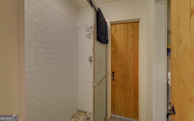 bathroom with a tile shower