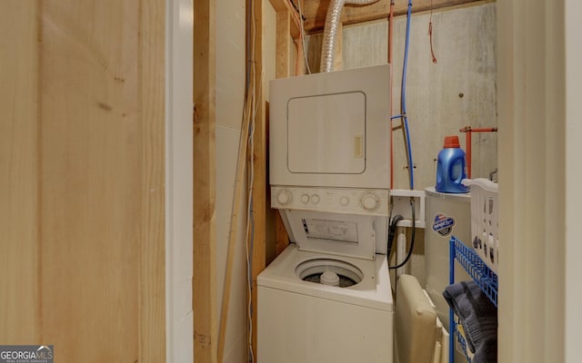 washroom featuring stacked washer / dryer