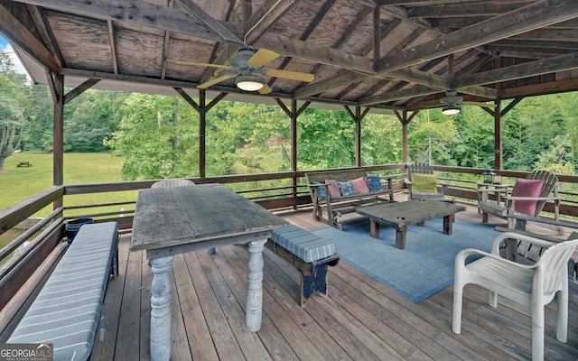 wooden deck featuring ceiling fan