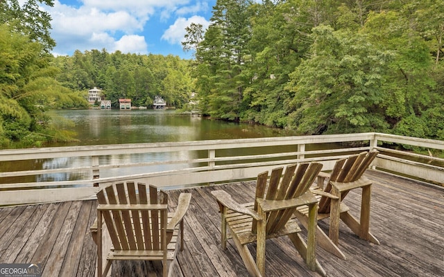 wooden deck with a water view