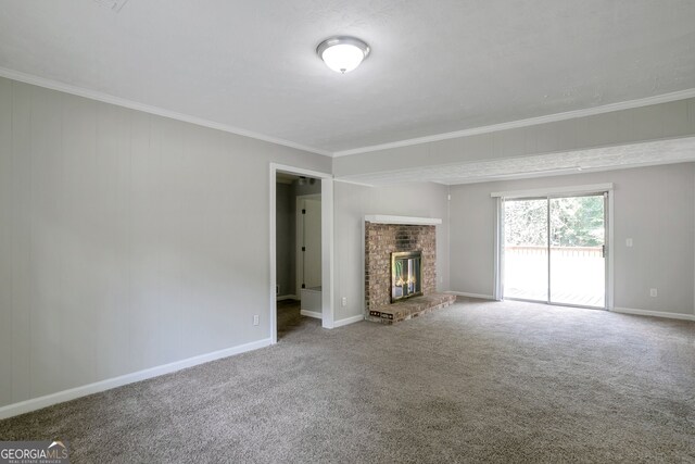 unfurnished living room with carpet, a fireplace, and ornamental molding