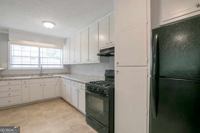 kitchen featuring white cabinetry, light tile patterned floors, sink, and black appliances