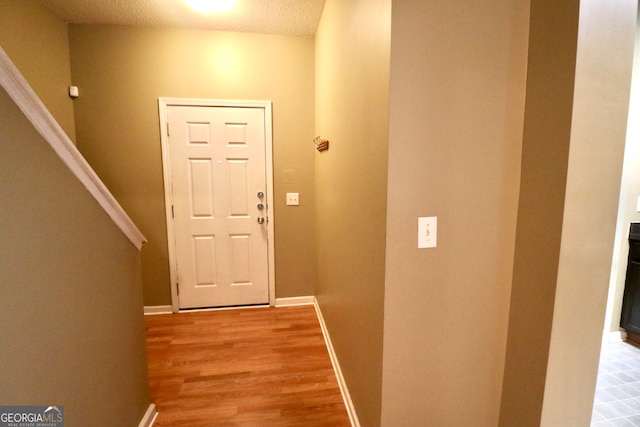 doorway featuring light hardwood / wood-style floors