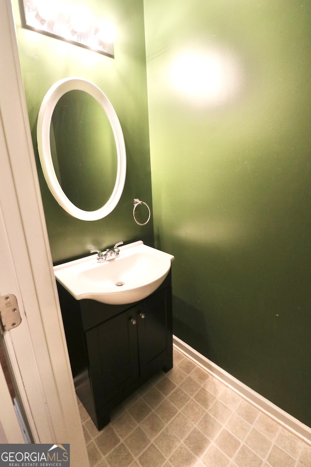 bathroom with tile patterned flooring and vanity