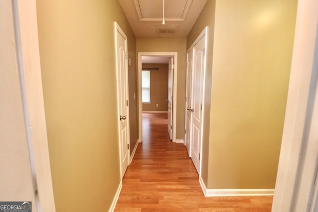 corridor featuring light hardwood / wood-style flooring