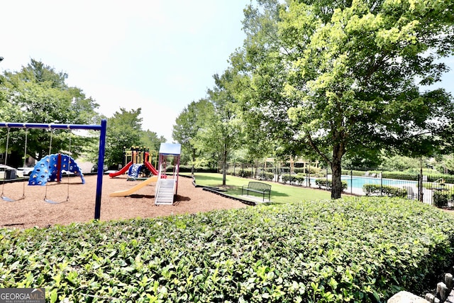 view of playground with a yard