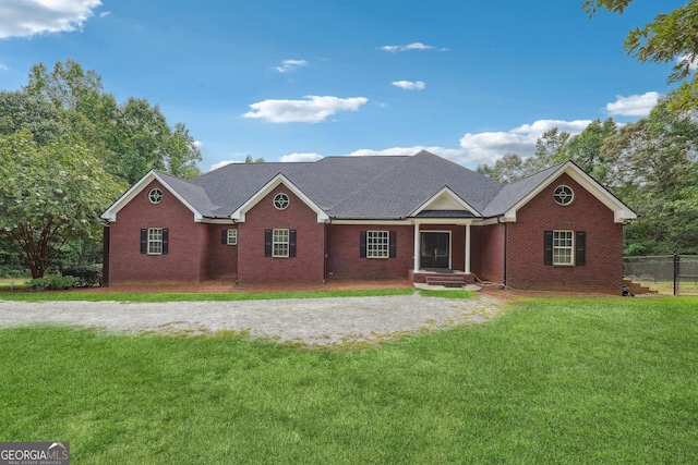 ranch-style house with a front yard