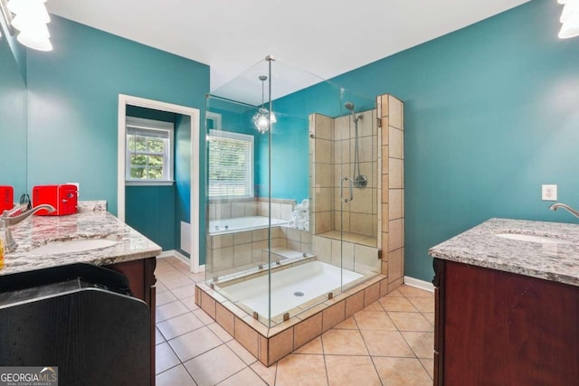 bathroom featuring independent shower and bath, tile patterned floors, and vanity