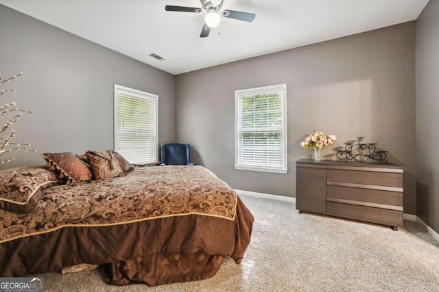 bedroom with ceiling fan and carpet flooring