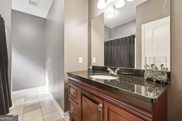 bathroom featuring tile patterned floors and vanity