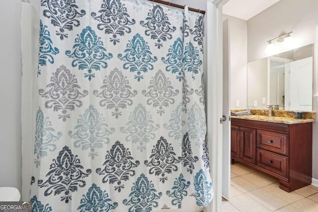 bathroom featuring tile patterned floors, vanity, and a shower with curtain