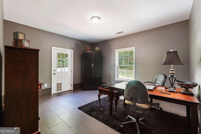 office featuring tile patterned floors and plenty of natural light