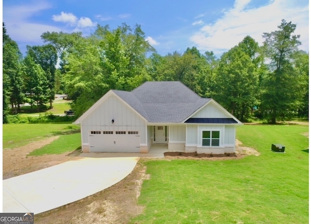 view of front of house featuring a front yard and a garage